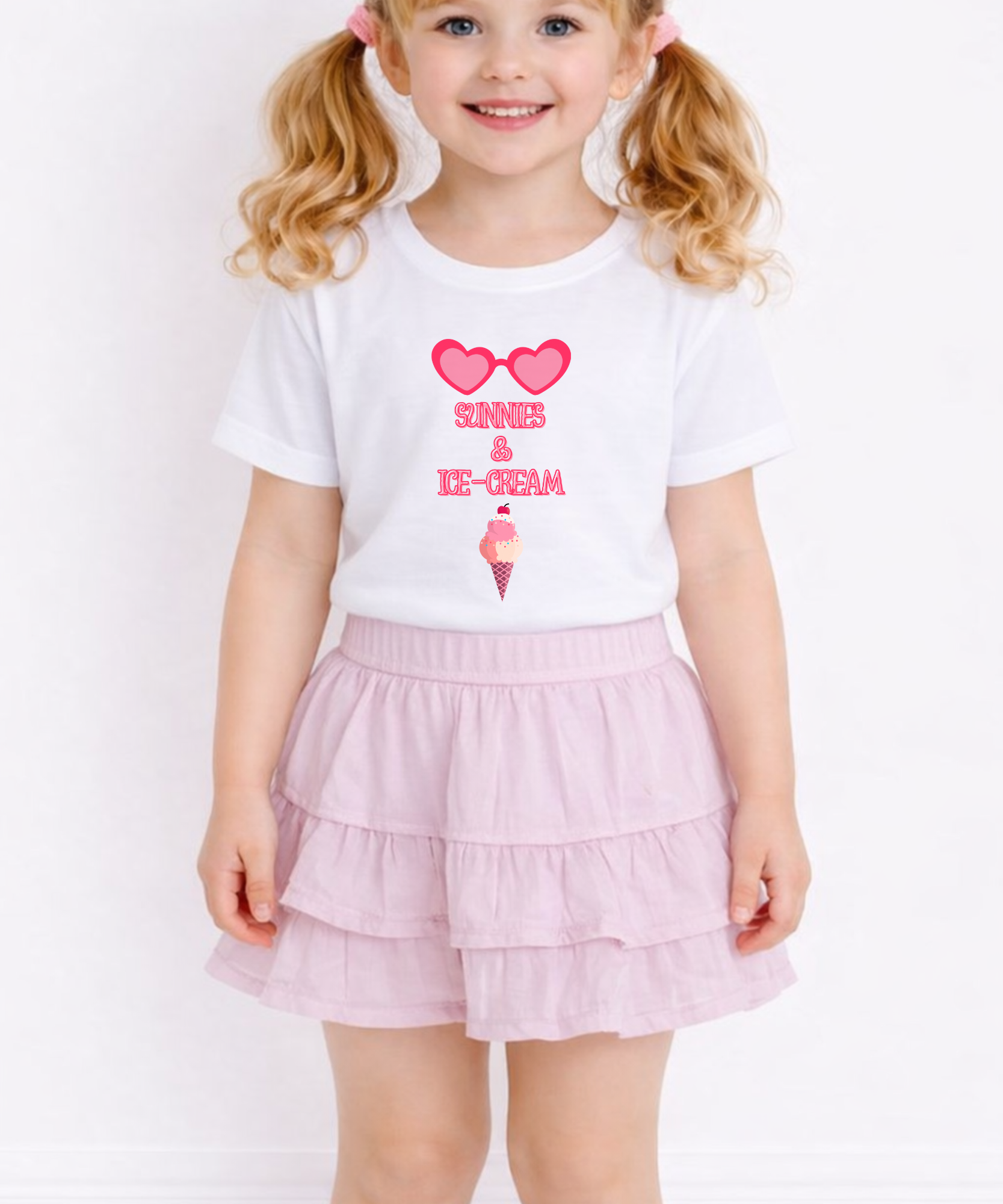 Child wearing a white t-shirt with pink text and a pink skirt on a white background
