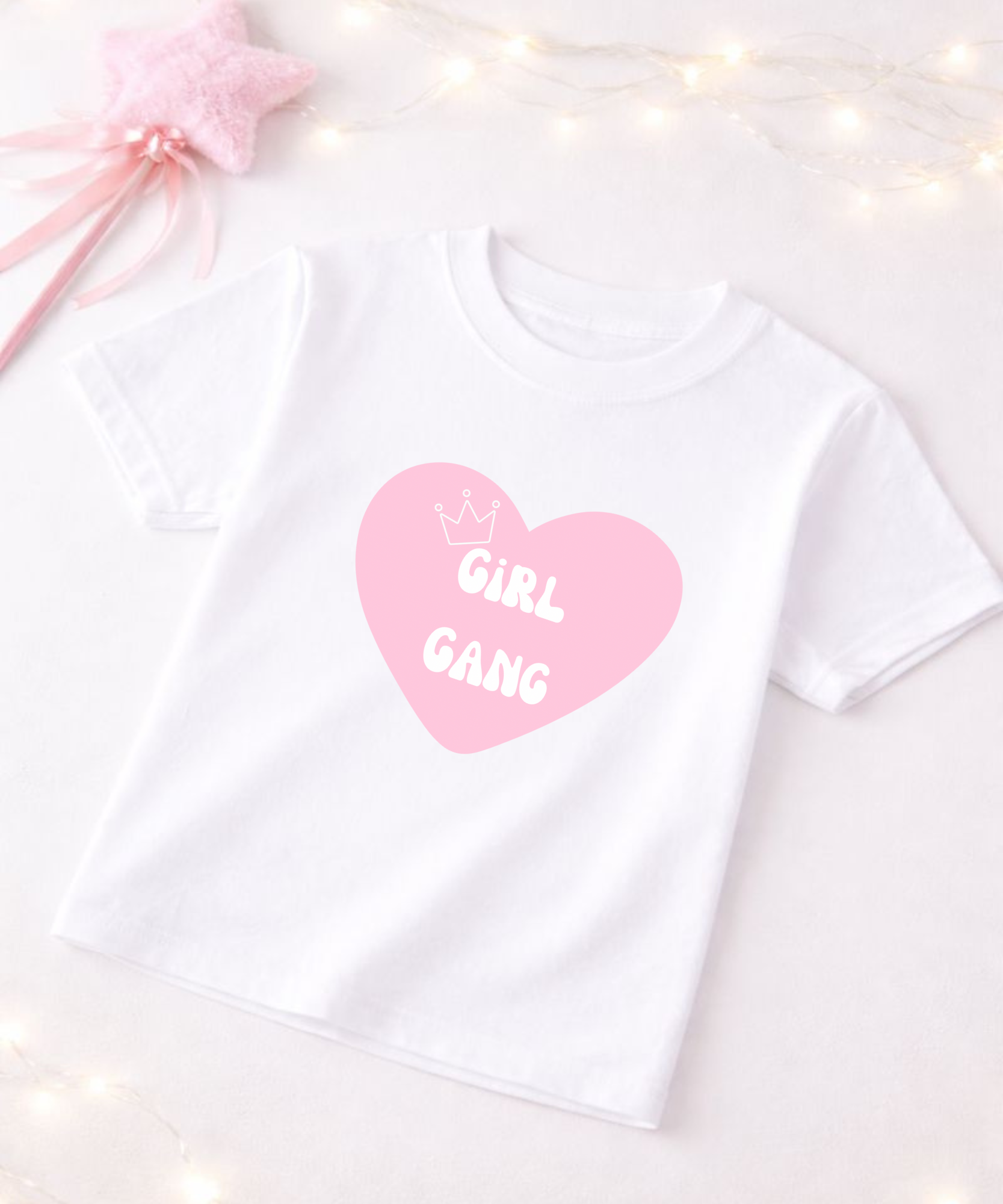 White t-shirt with pink heart and 'Girl Gang' text on a light background